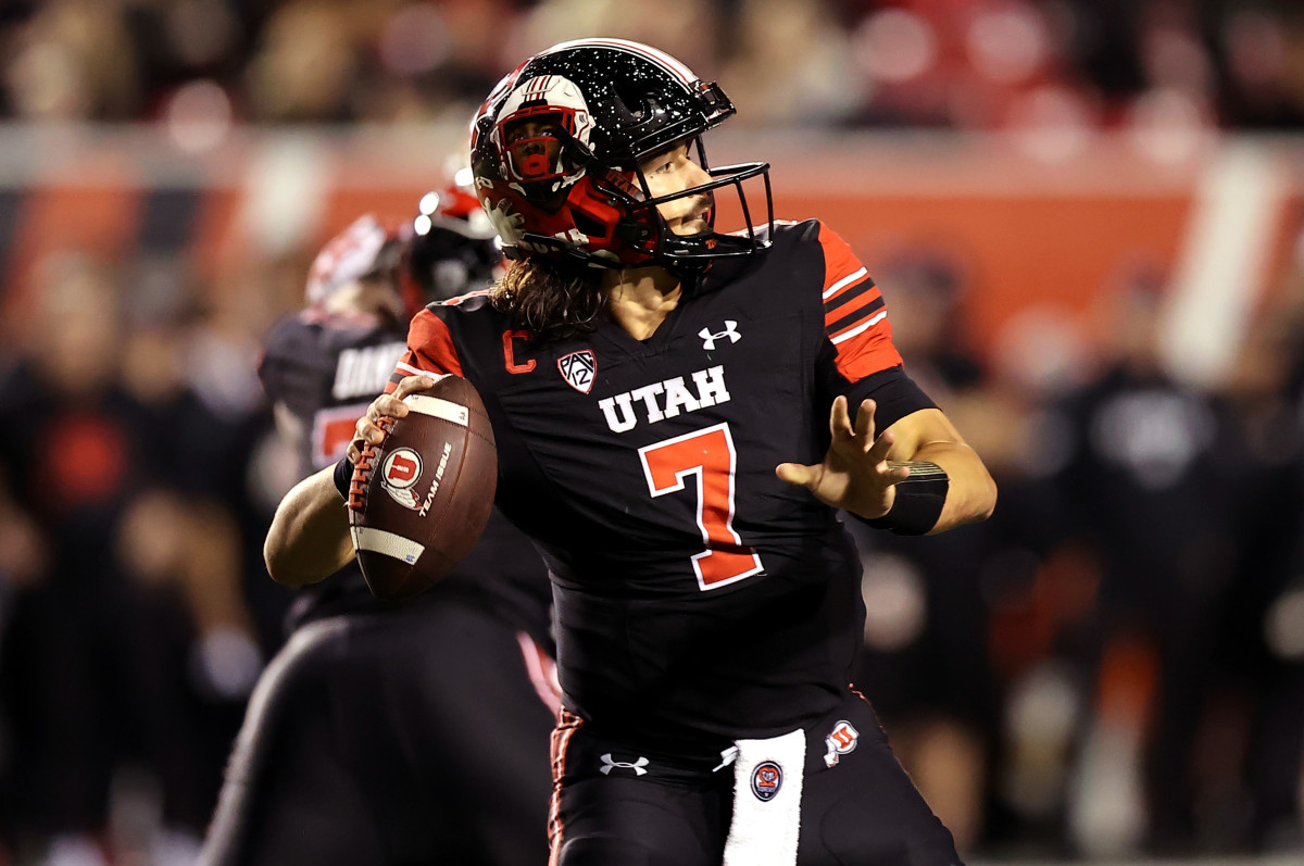 Utah Utes quarterback Cameron Rising (7) throws against the USC Trojans in the second half at Rice-Eccles Stadium.